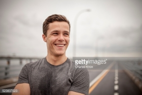 523837023-young-man-smiling-portrait-gettyimages